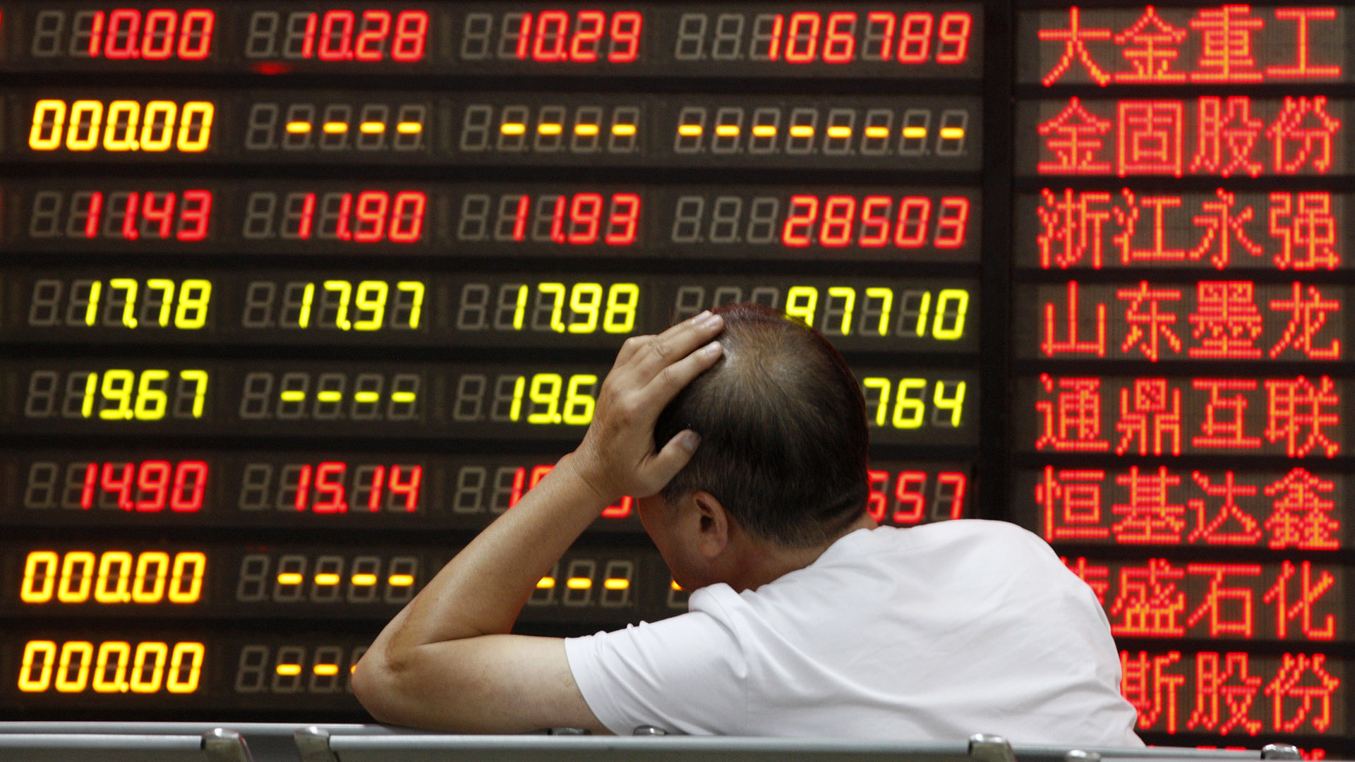 An investor watchs electric board in a stock market in Huaibei, Anhui province, east China on September 7 2015.