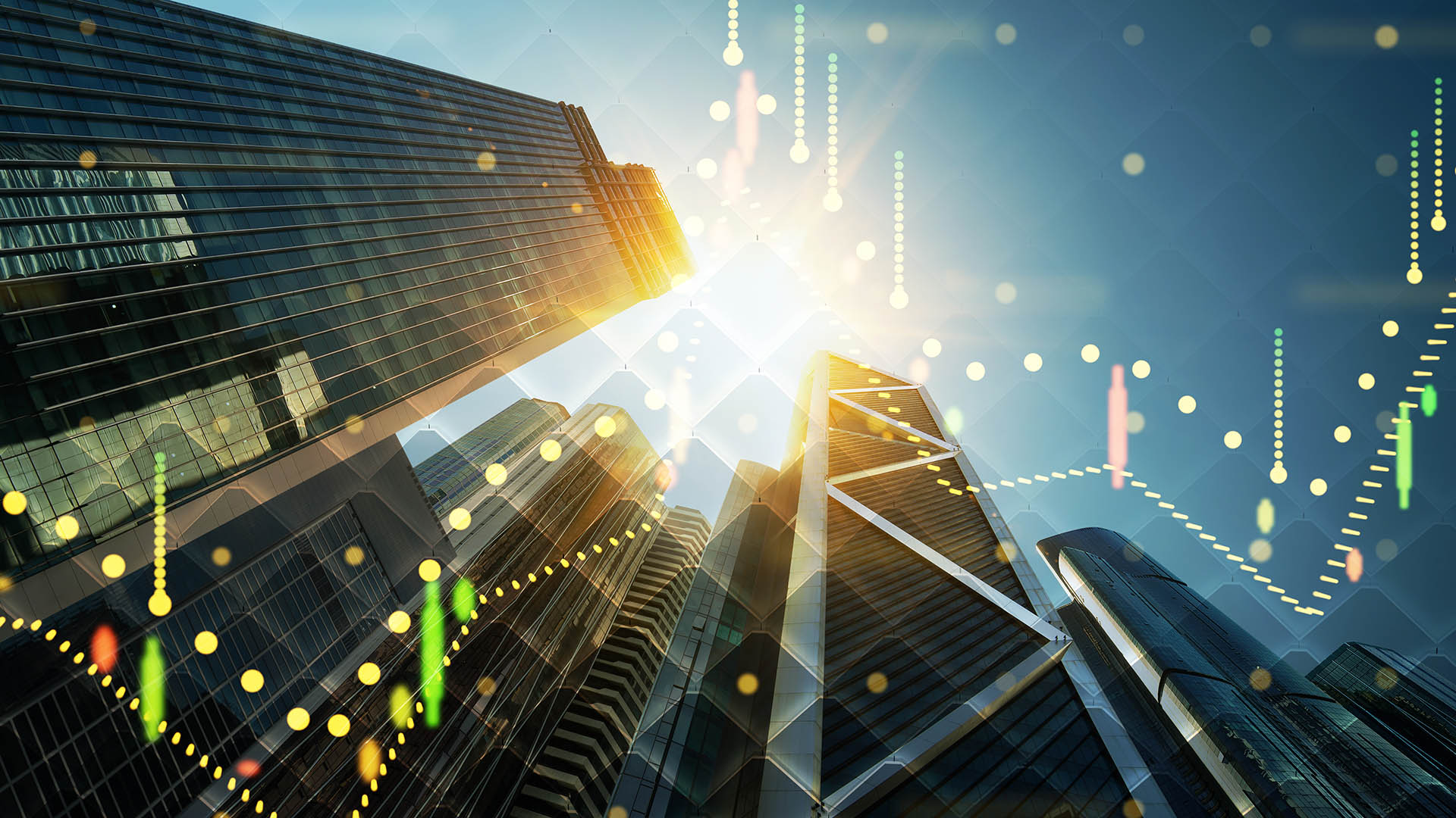 City low angle view on a sunny day with square tiles pattern and financial graphs in the foreground. Concept of city life and business. Double exposure.