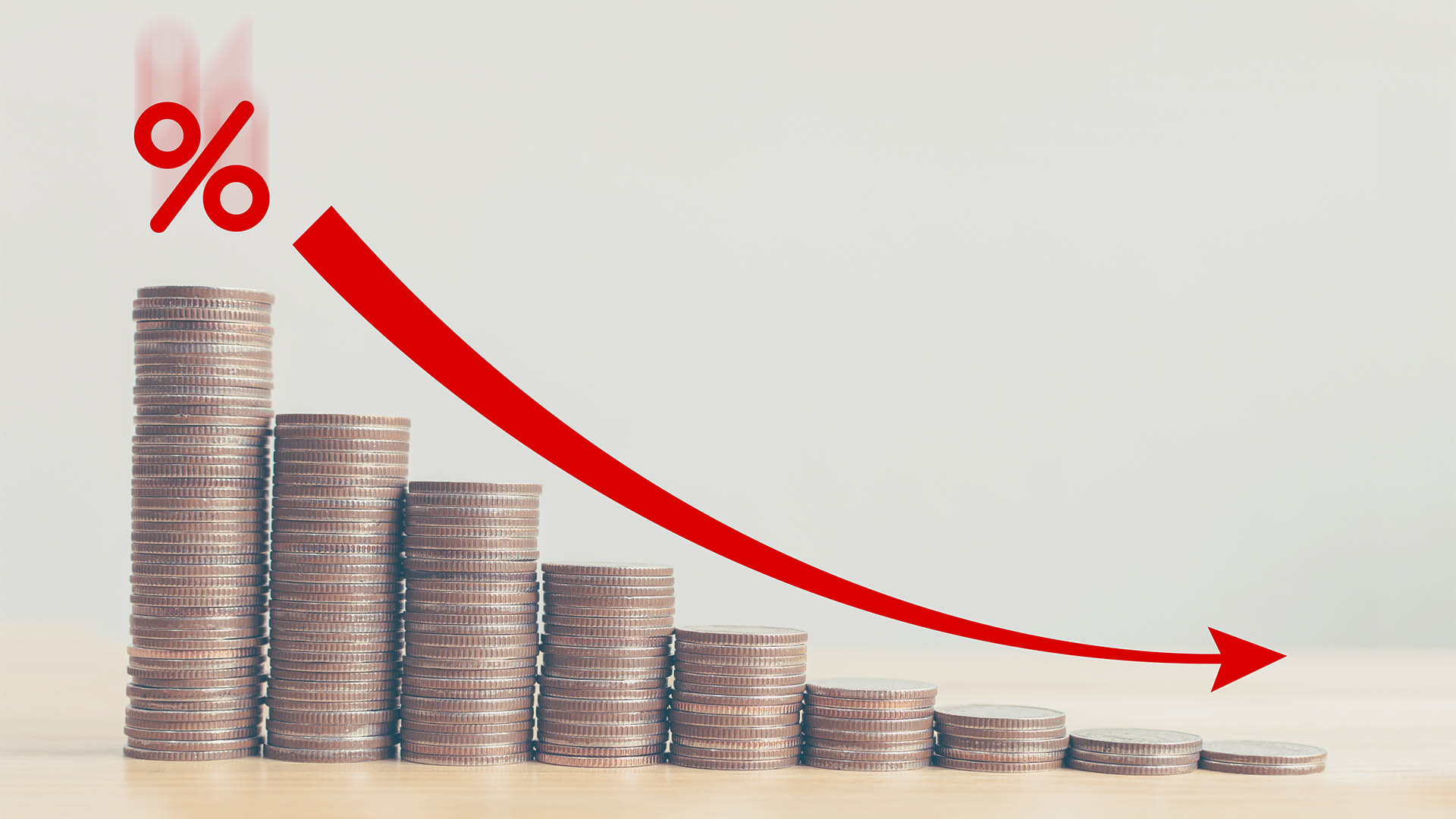 Coin stack step down graph with red arrow and percent icon, Risk management business financial and managing investment percentage interest rates concept