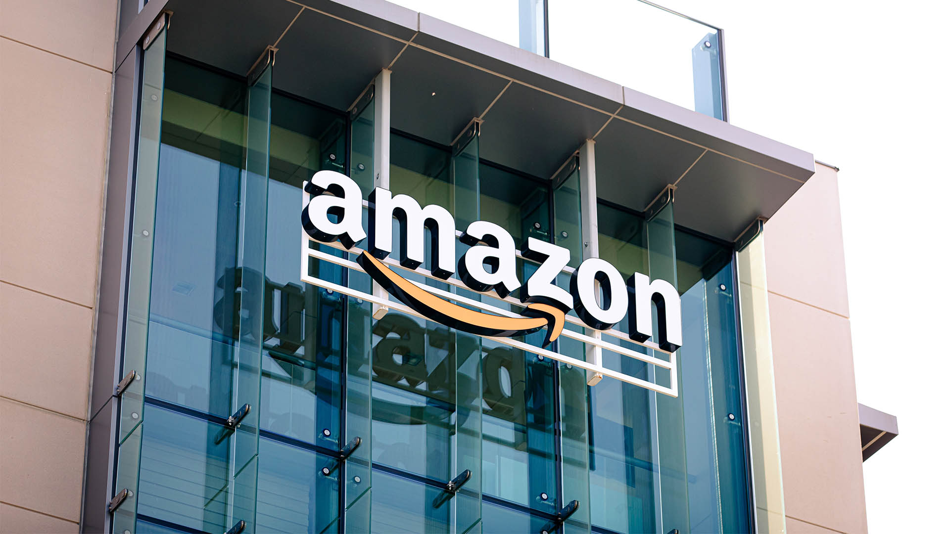 Palo Alto, California US - August 24, 2024: Closeup of Amazon logo on the company office building in Palo Alto, Silicon Valley, San Francisco Bay Area. Amazon sign on glass modern office building wall