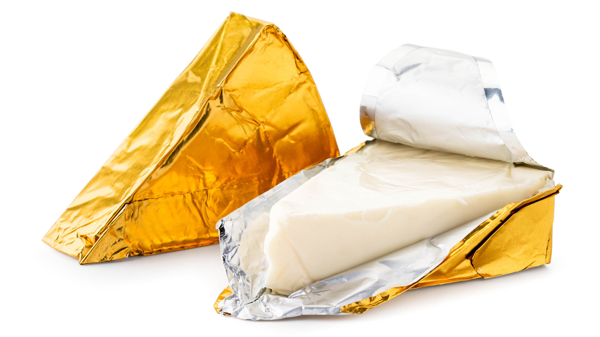 Cheese triangle in foil unpacked close-up on a white. Isolated
