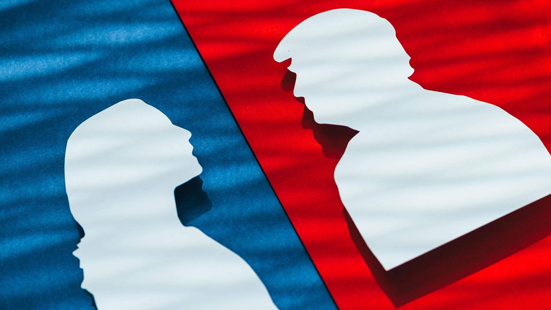 NEW YORK, USA, 30 AUGUST, 2024: Kamala Harris and Donald Trump papercut. A photo for the 2024 U.S. election or debate, featuring red and blue colors representing Republican vs Democrat rivalry