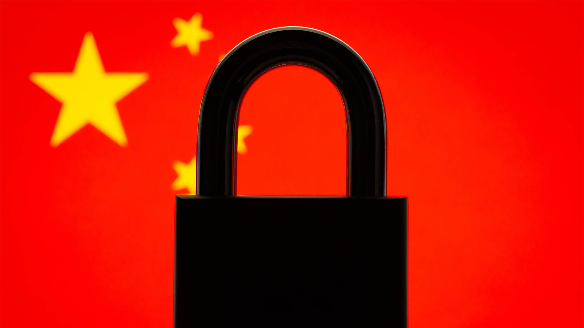 Silhouette of lock with flag of China in the background. International isolation of China, restrictions, closed country
